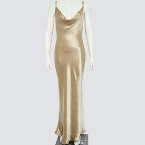Detail of champagne gold satin cowl neck dress with thin straps and metallic shine