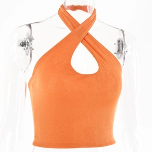 Detail of orange halter top showing ribbed texture and cross neckline cutout