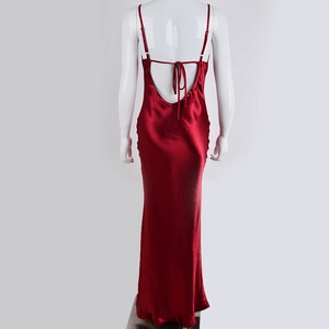 Detail of deep red satin dress showing backless design with adjustable thin straps