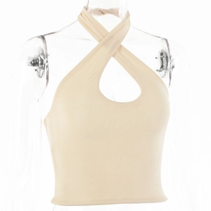 Close-up of beige knitted halter top with criss-cross neckline and teardrop cutout detail