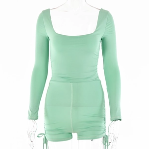 Detail of mint green long sleeve romper with square neck and side ruched drawstring design