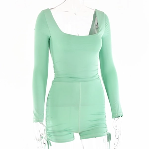 Detail of square neck long sleeve romper with side drawstring ruched shorts in mint green