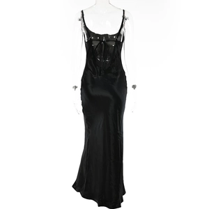 Detail of a backless black satin evening dress with thin straps and a lace-up bow design