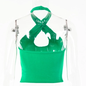 Detail view of the back of a grass green halter top with a stylish crisscross design