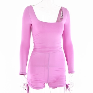 Detail of pink long sleeve romper with side drawstring ruching and square neckline