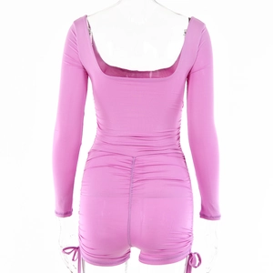 Back view of pink long sleeve romper with backless U-neck and ruched drawstring details