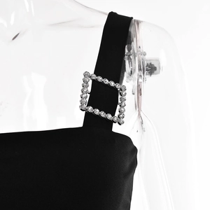 Close-up of the black satin strap featuring a silver buckle with sparkling rhinestones