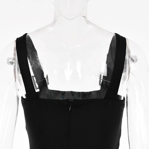 Detail view of the black dress back featuring a hidden zipper and sparkling rhinestone straps