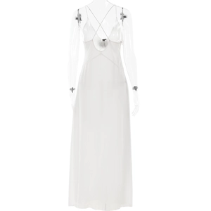 Detail of elegant white chiffon maxi dress featuring delicate cross straps and open back