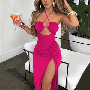 Detail view of hot pink halter neck dress featuring ruched side and sexy high slit design