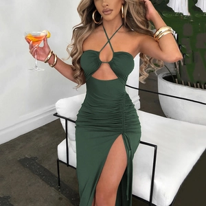 Detail of cross halter neck and cutout design on dark green slim fit maxi dress