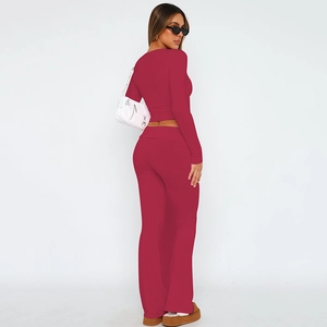 Detail view of the rose red high waist flared leggings and matching slim crop top set