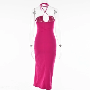 Detailed back view of magenta halter dress featuring cross-tie straps and backless design