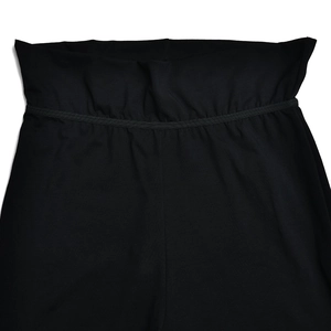 Detail of high-waisted wide elastic waistband on these sleek black fitness pants