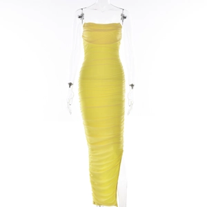 Detail of yellow bodycon maxi dress featuring full ruching and elastic mesh fabric