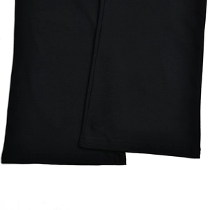 Detail view of the high-quality double-stitch hem on these black high-waisted pants
