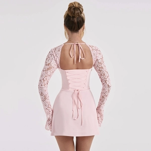 Detailed back view of light pink mini dress with lace sleeves and backless tie design