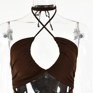 Detail of brown halter top with pleated crossover neckline and center cutout design