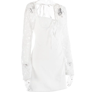 Detail of white lace long sleeves and bodice tie-up on a slim fit mini dress