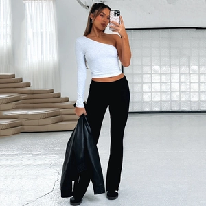 Women's white one-shoulder crop top and black high-waisted flared trousers outfit set