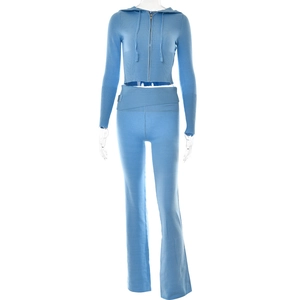 Detail of light blue knitted set with cropped zip hoodie and high-waisted flare trousers