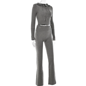 Detail view of grey knitted set featuring ribbed cropped hoodie and flared high-waist pants