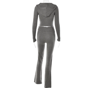 Detailed back view of a grey knitted two-piece set with hooded top and flared trousers