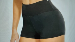 Close-up of black high-waisted slimming athletic shorts with elastic compression fit
