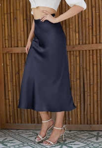Elegant navy blue satin midi skirt with side slit and high elastic waist on model