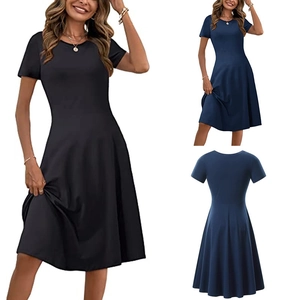 Detail view of round neck short sleeve dress showing the waistline and A-line skirt drape