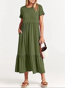 Dark green short sleeve maxi dress with tiered skirt and side pockets for casual wear