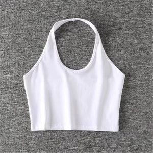 Flat lay of a plain white halter neck crop top made from soft ribbed knit fabric