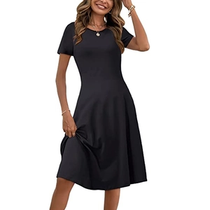 Detail of slim-fit waist and flowing A-line hem on this elegant black short sleeve dress
