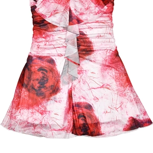 Detailed view of red and white floral mesh dress with ruched waist and ruffle trim
