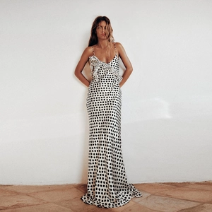 Detail of satin polka dot maxi dress featuring ruffle V-neck and delicate straps