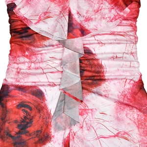 Detailed close-up of rose print mesh fabric with gathered ruffles and romantic texture