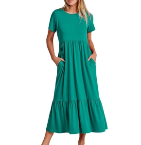 Close-up of emerald green tiered long dress with short sleeves and functional side pockets