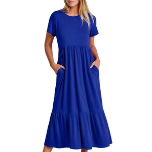 Detail of dark blue maxi dress showing side pockets and soft cotton pleated waist texture