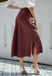 Detailed side view of wine red midi satin skirt with elegant high slit and high waist