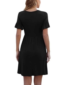 Detail view of the black dress back with elegant ruffle sleeves and slim A-line waist