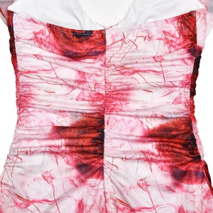 Detailed view of red rose floral print dress with ruched center and elastic fabric