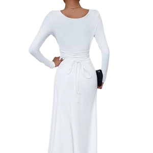 Detailed back view of white long sleeve dress showing elegant waist tie and bow design