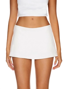 White low-rise mini skort with built-in shorts for women, sporty and minimalist style