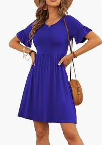 Detail of the bright blue dress showing ruffle sleeves and soft knitted fabric texture