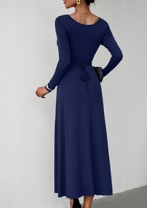 Detail view of the elegant navy blue long sleeve dress with waist tie back detail