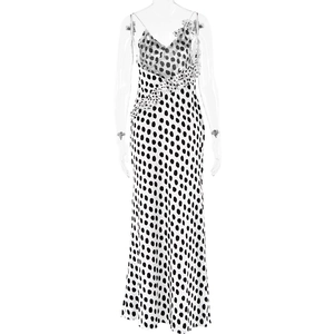 Detailed back view of white satin maxi dress with black polka dots and ruffle neckline