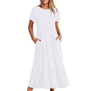 Detail of the layered tiered skirt and side pocket on this white casual maxi dress