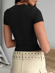 Rear view of tight black short sleeve T-shirt with slim fit and round neckline cut