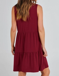 Back view of a burgundy sleeveless tiered dress with casual layered knit fabric design