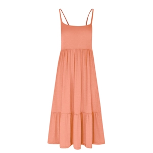 Detail of a salmon pink sleeveless tiered maxi dress with thin straps and airy fabric